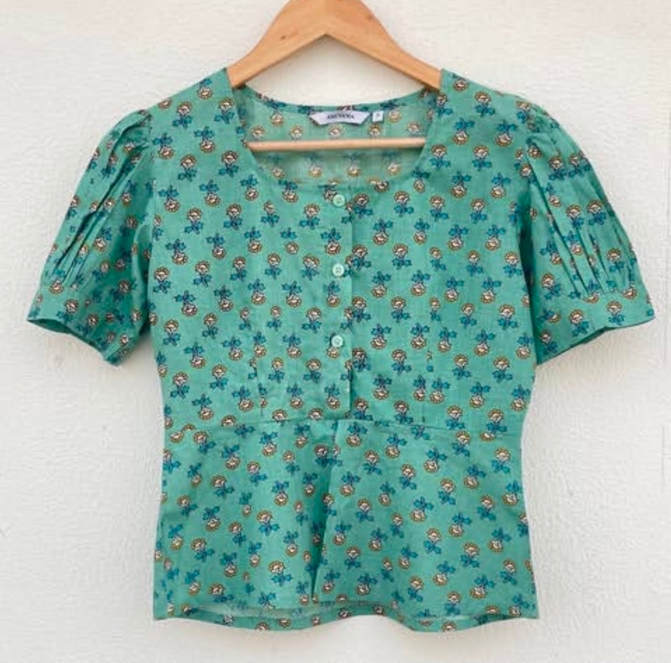 PEPLUM BUTTON DOWN TOP