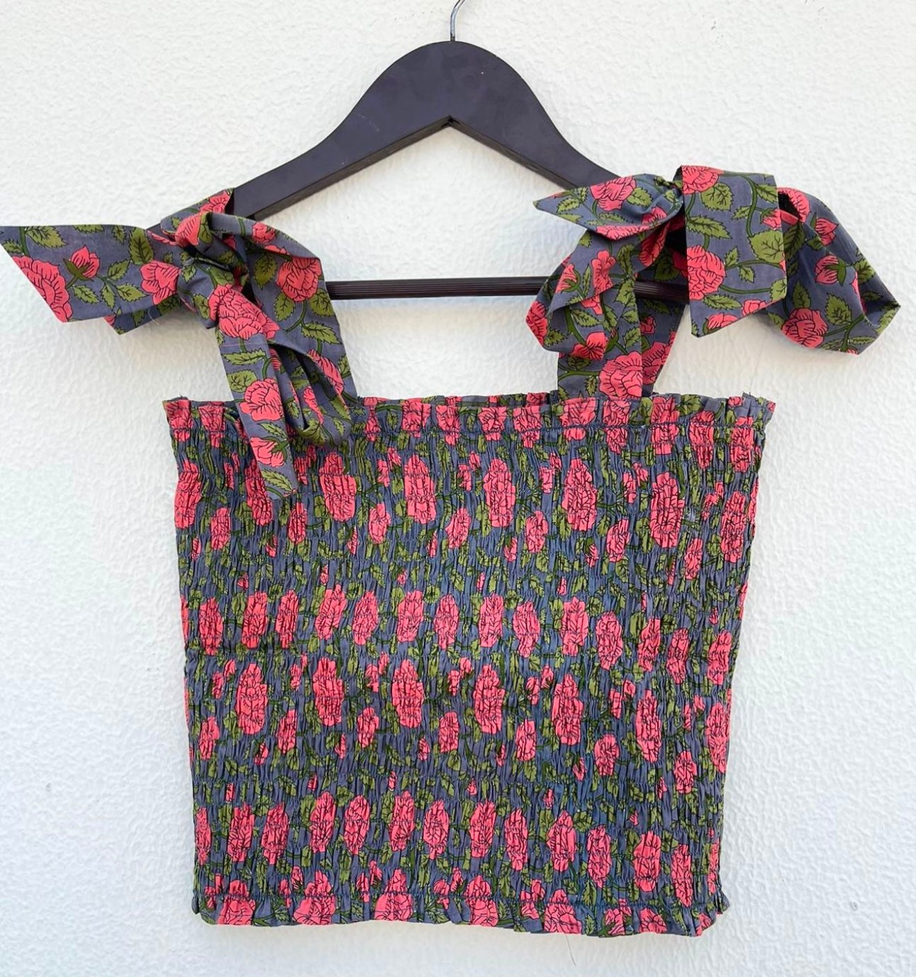 SMOCKED TOP WITH BOW ACCENT